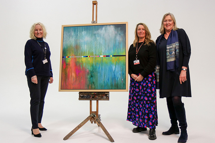 PR24-008 - Helena Thomas, Jo Taswell and Cllr Rita Garner pictured with Jo's winning artwork