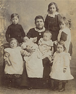 Old family group photo (old woman with seven grandchildren)