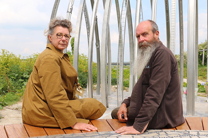 Jane Fordham and David Parfitt on the bench at the Shoreham Airshow Memorial site