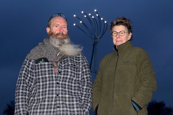 Artists Jane Fordham and David Parfitt standing in front of the new lights at the Shoreham Airshow Memorial