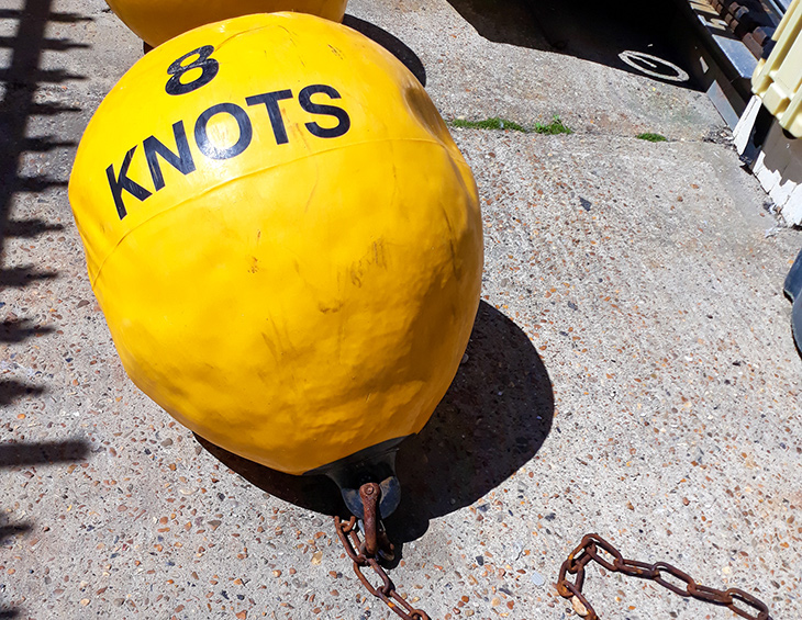 Yellow 8 knot speed restriction marker buoy