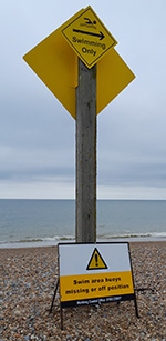 Swimming zone sign - yellow diamond shape sign (with missing buoys sign)