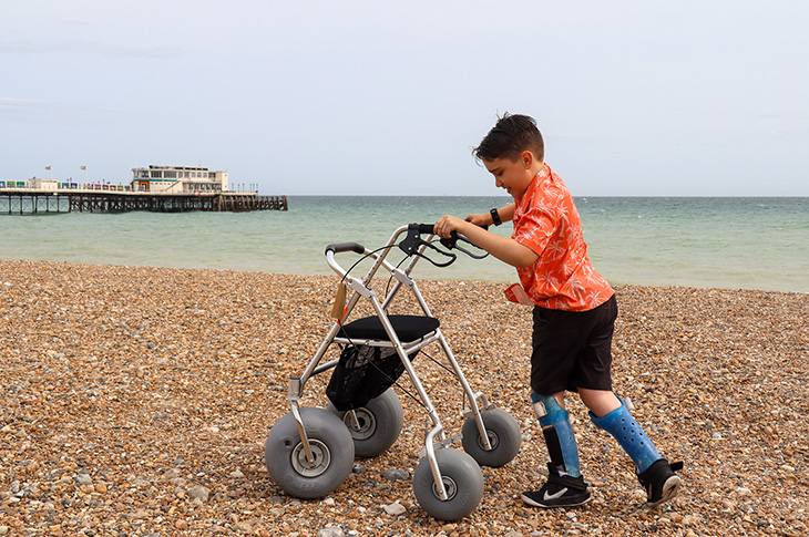 Local resident, Harry Ragless, testing out the all-terrain rollator on Worthing Beach
