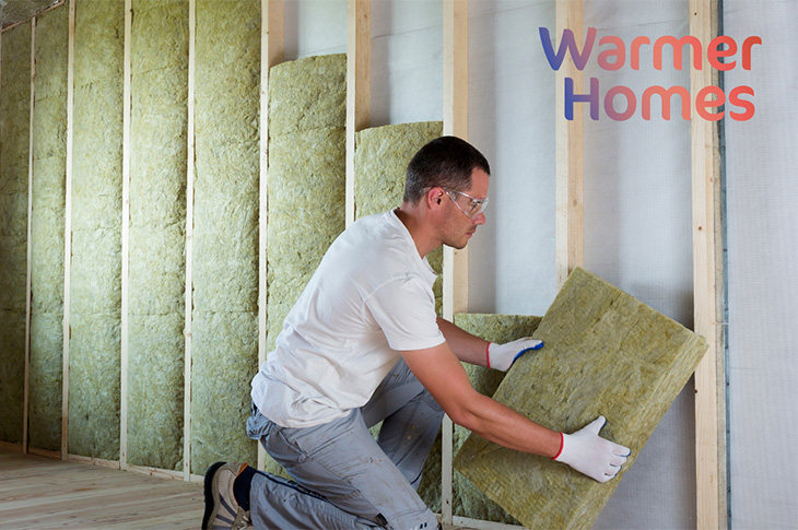PR23-143 - Installing insulation (credit Warmer Homes)