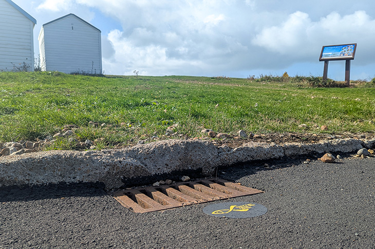 A surface drain by the beach huts at Beach Green, Southwick Beach