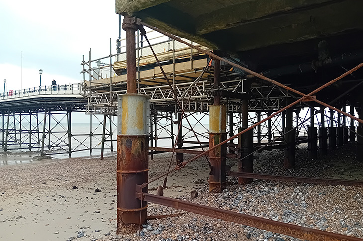 Worthing Pier - the supporting legs and metal work under the pier