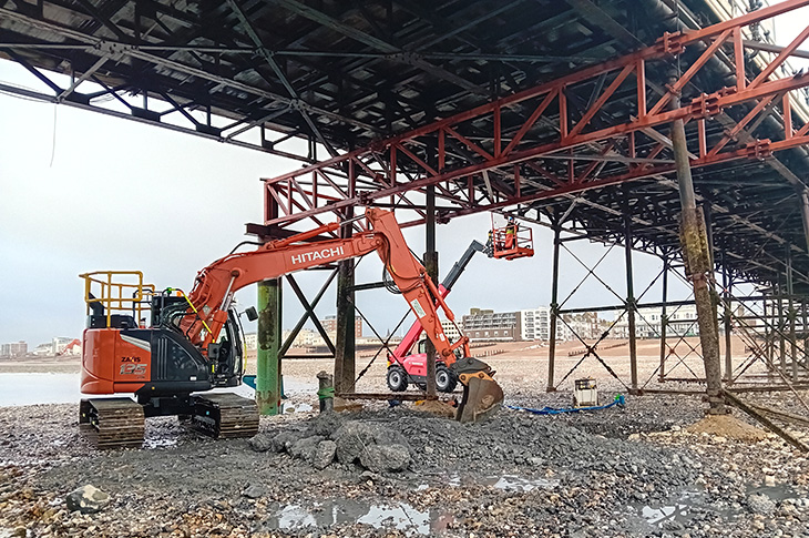 Worthing Pier - council engineers & experts from Mackley & HOP Consulting examining the damaged section of the pier