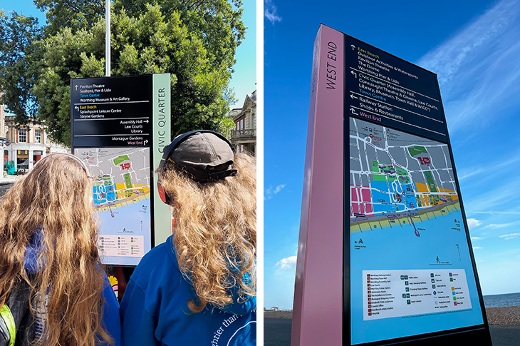 Worthing Wayfinding sign - two people looking at one of the signs, and another of the signs by the beach
