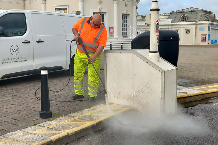 Jet washing the steps outside the Pavilion Theatre on the end of Worthing Pier