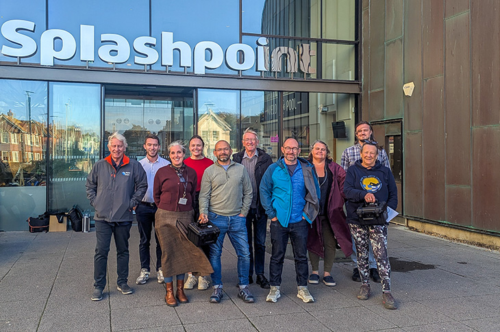 PR26-096 - Sea swimmers with representatives of Southern Water, Worthing Council and Planet Ocean outside Splashpoint